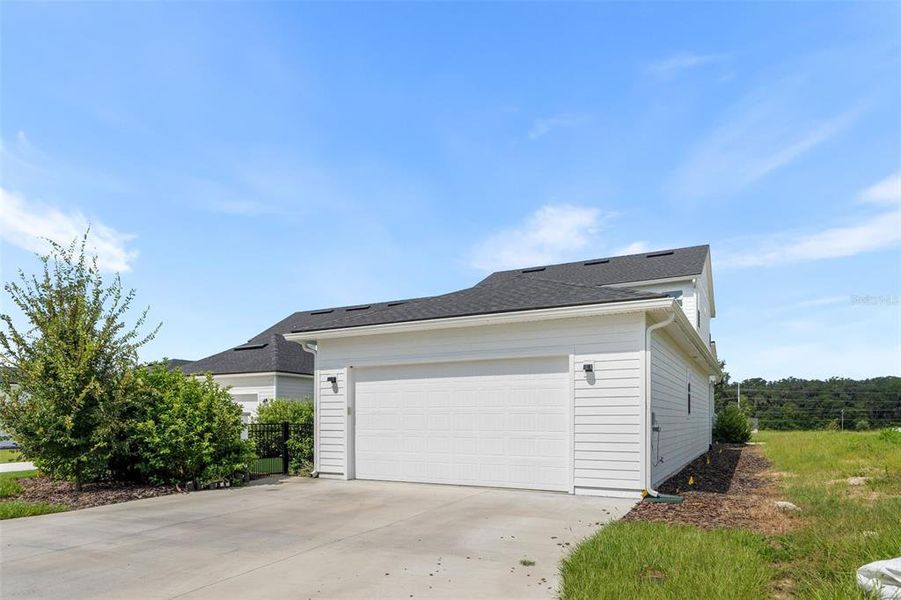 Front exterior of a new home in Oakmont, Gainesville, FL, highlighting curb appeal (Image 27). Front exterior of a new home in Oakmont, Gainesville, FL, highlighting curb appeal (Image 27).