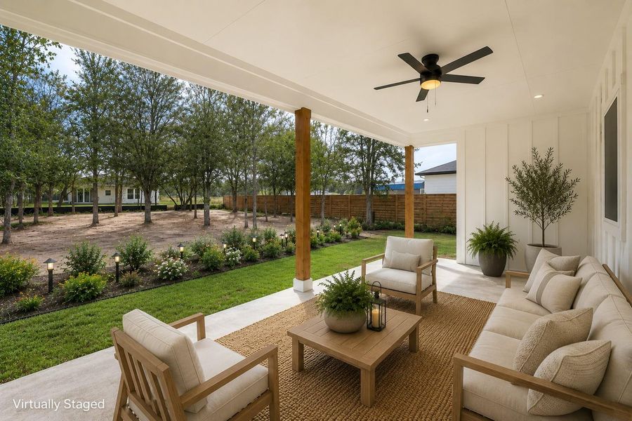 An inviting covered patio offers ample space for outdoor relaxation and entertaining.