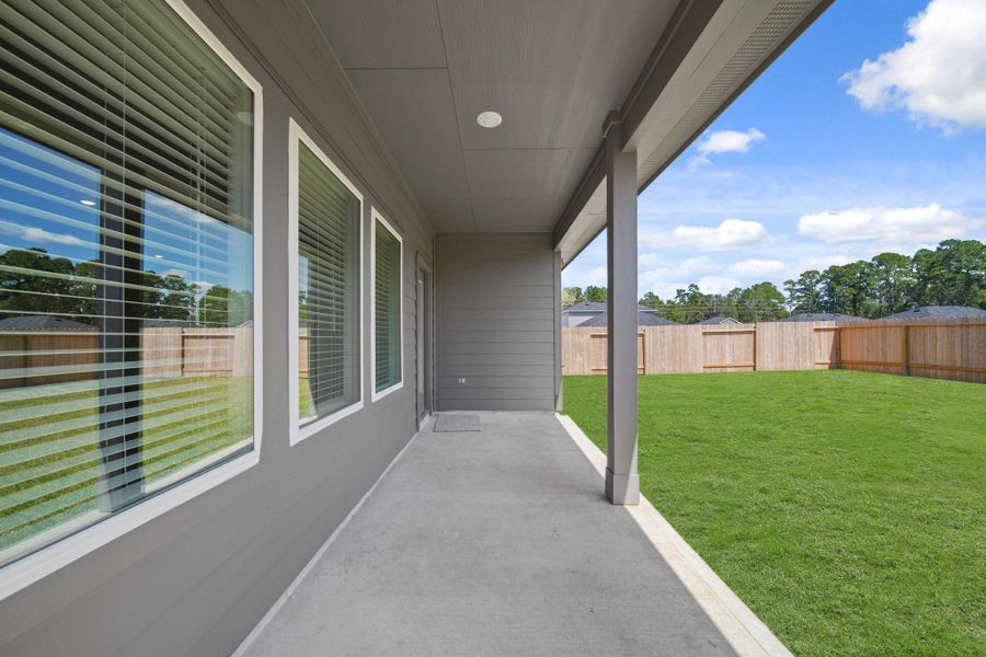 Exterior details and patio area of a home in Grand Pines, Magnolia (Image 14). Exterior details and patio area of a home in Grand Pines, Magnolia (Image 14).
