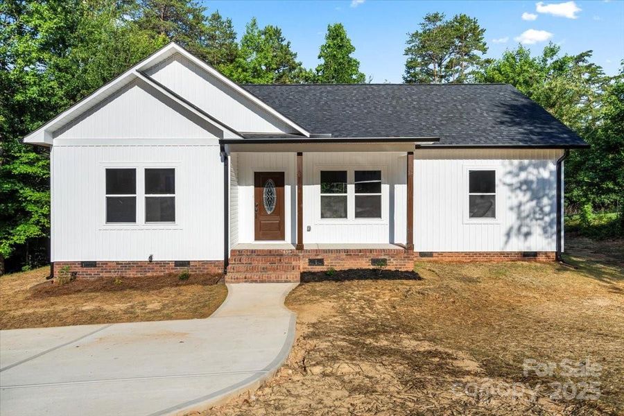Front exterior of a new home in , Gastonia, NC, highlighting curb appeal (Image 2). Front exterior of a new home in , Gastonia, NC, highlighting curb appeal (Image 2).