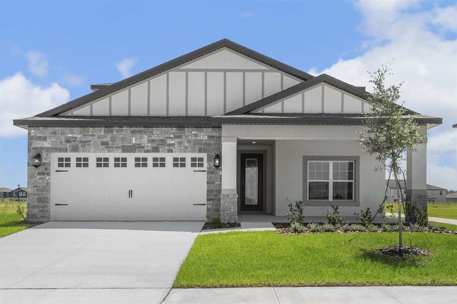Front exterior of a new home in Gum Lake Preserve, Lake Alfred, FL, highlighting curb appeal (Image 1).