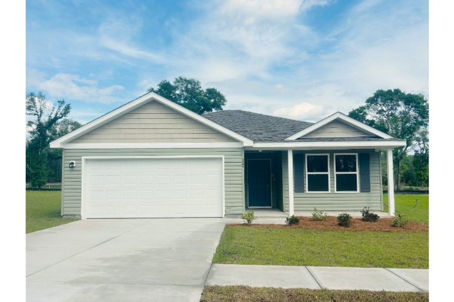 Front exterior of a new home in The Enclave at Cat Island Estates, Defuniak Springs, FL, highlighting curb appeal (Image 1). Front exterior of a new home in The Enclave at Cat Island Estates, Defuniak Springs, FL, highlighting curb appeal (Image 1).
