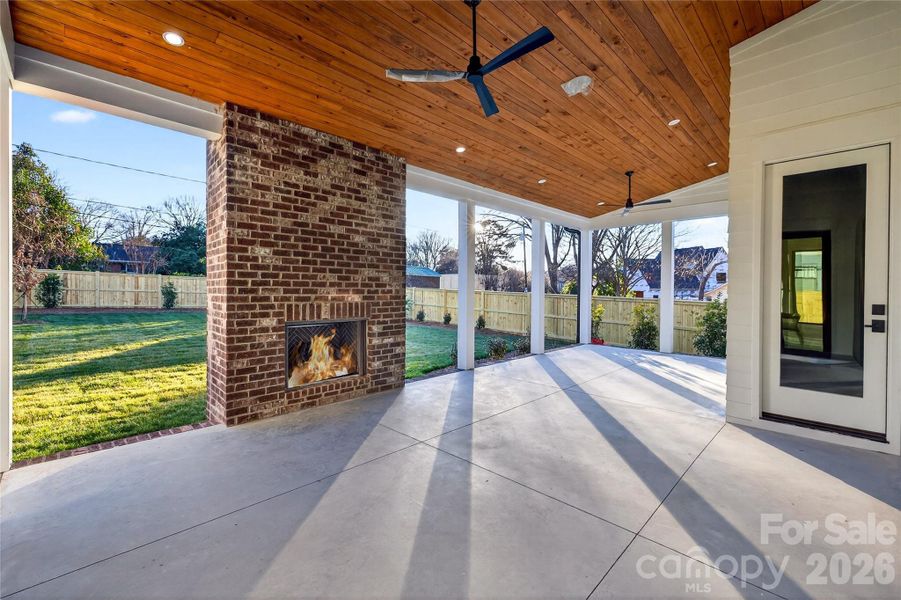 Beautiful view of the large Rear Porch looking out on the back lawn. Plenty of space for dining and sitting areas. Door leads to the Bedroom on Main.
