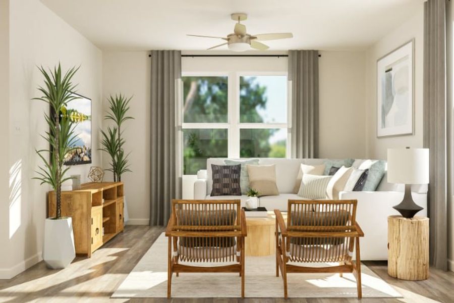 A living room with a white couch and a table. A living room with a white couch and a table.