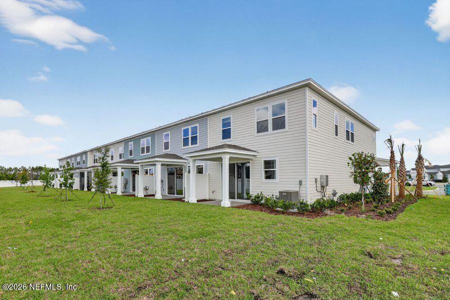 Exterior details and patio area of a home in Cherry Elm at SilverLeaf, St. Augustine (Image 3).