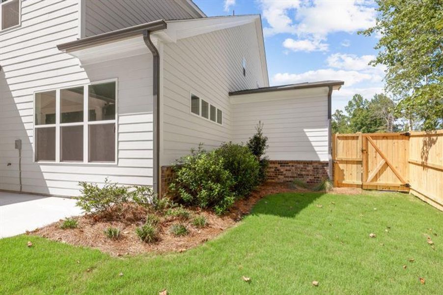 Exterior details and patio area of a home in Arden on Lanier, Cumming (Image 18).