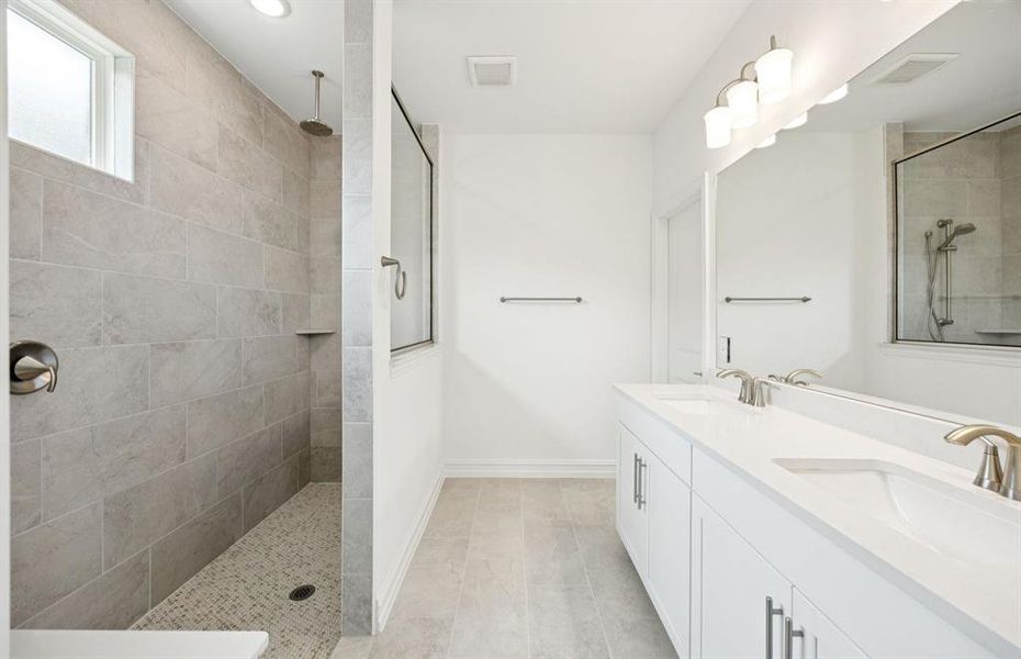 Owner's bath with large shower and double vanity *real home pictured Owner's bath with large shower and double vanity *real home pictured