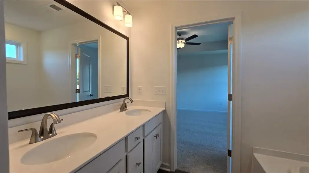 Clean lines and a double vanity define this functi