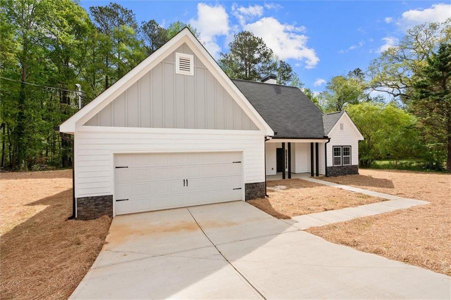 Front exterior of a new home in , Villa Rica, GA, highlighting curb appeal (Image 22).