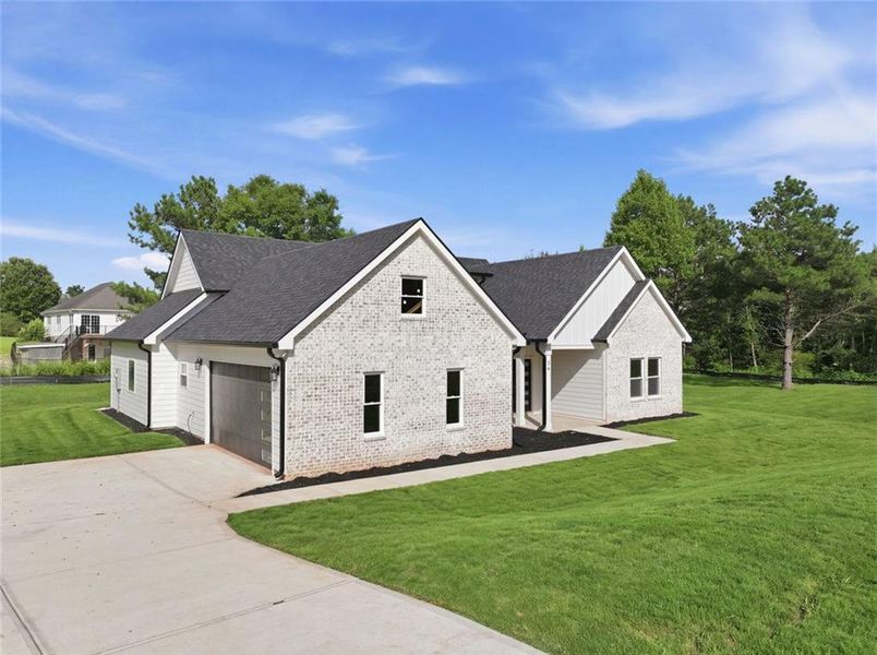Front exterior of a new home in , Commerce, GA, highlighting curb appeal (Image 2). Front exterior of a new home in , Commerce, GA, highlighting curb appeal (Image 2).