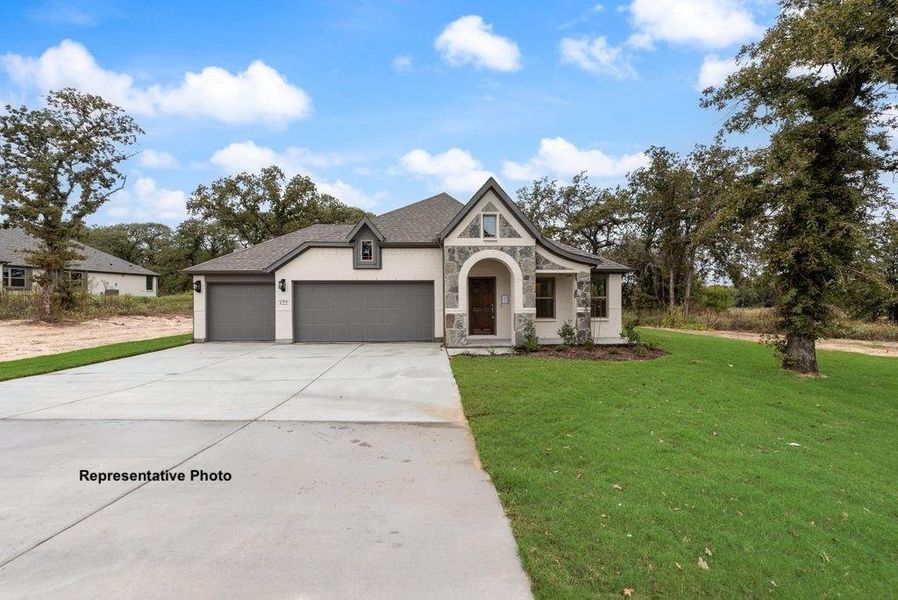 Front exterior of a new home in , Springtown, TX, highlighting curb appeal (Image 1). Front exterior of a new home in , Springtown, TX, highlighting curb appeal (Image 1).