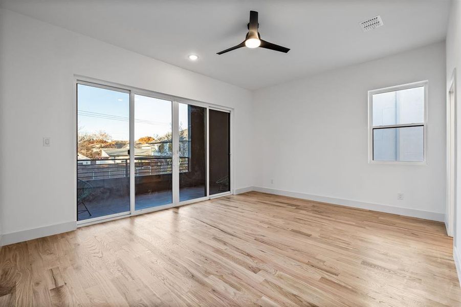 Spare room with ceiling fan and light wood-type flooring