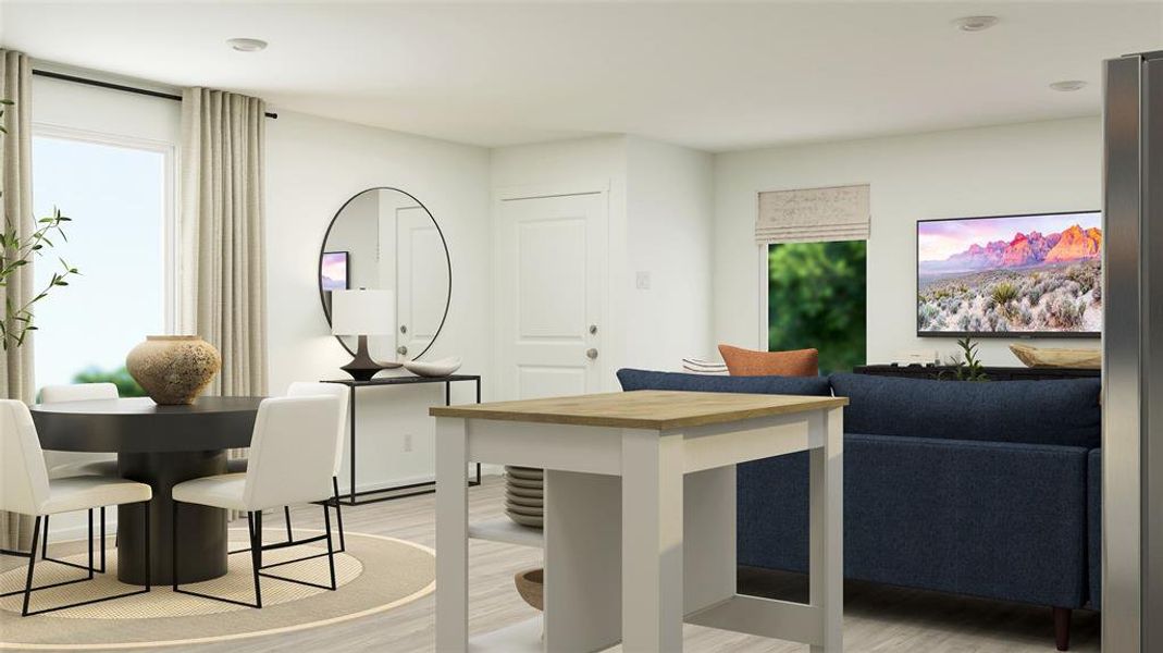 Dining space with light hardwood / wood-style flooring