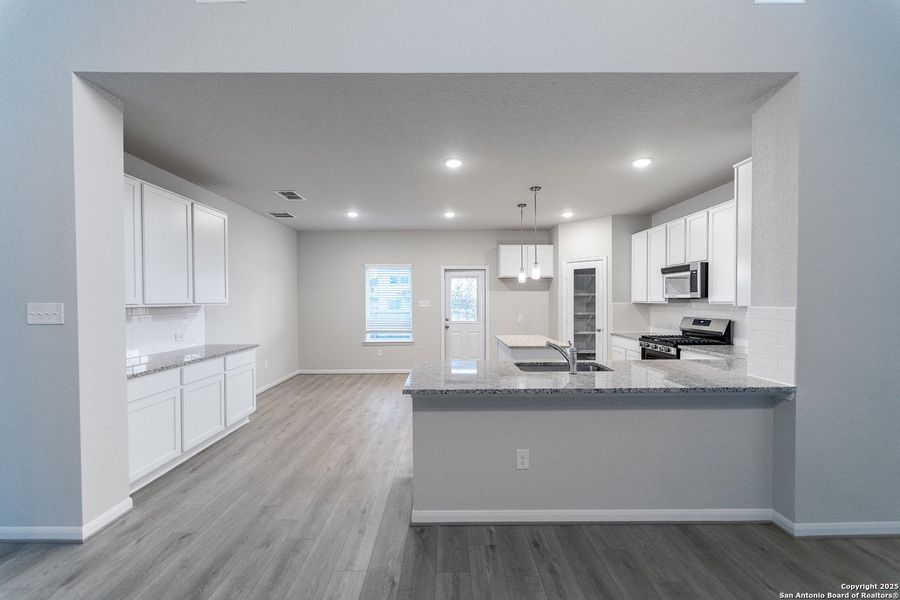 Furnished interior view inside a new home in Hennersby Hollow, San Antonio (Image 2). Furnished interior view inside a new home in Hennersby Hollow, San Antonio (Image 2).