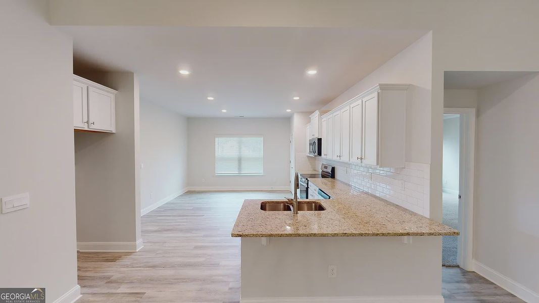 Furnished interior view inside a new home in Holliday Pass, Griffin (Image 4).