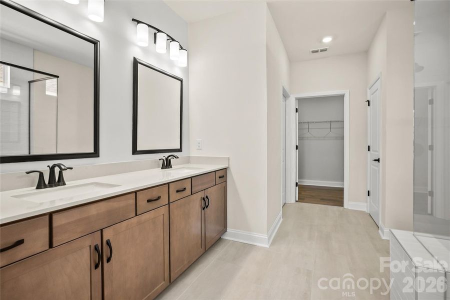 Luxurious primary bathroom, walk-in closet