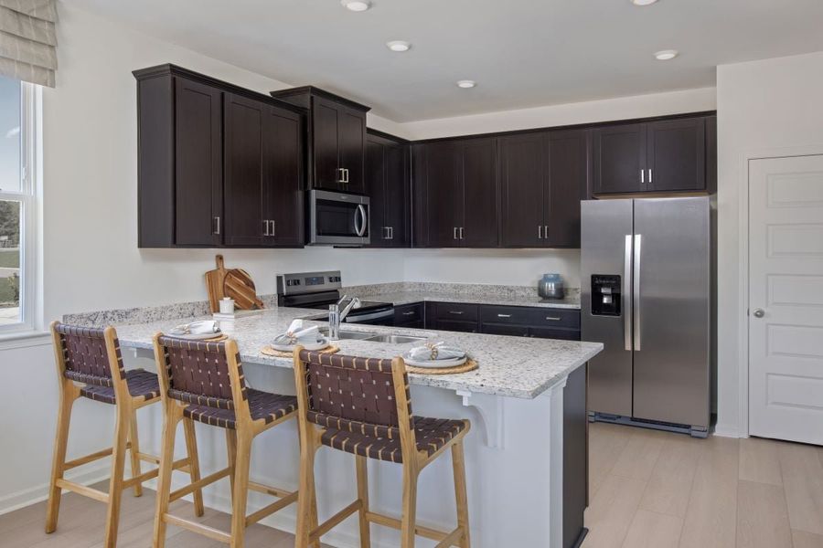 Representative furnished interior of a home built from the Plan 1808 Modeled by KB Home in Bellina, York (Image 7).