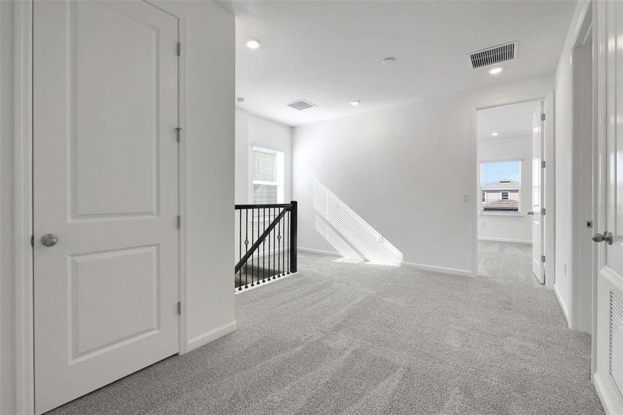 Spacious, unfurnished interior of a new home in Serenade at Ovation, Winter Garden (Image 20).