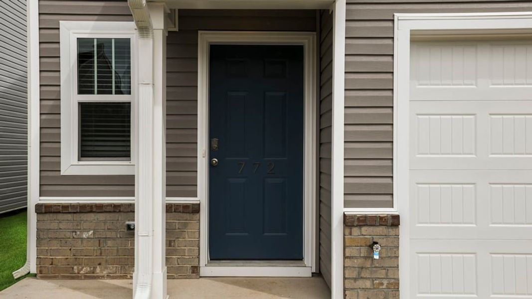 Exterior details and patio area of a home in Covington Village, Greer (Image 4).