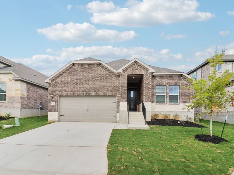 Front exterior of a new home in Sagebrooke - Classic Series, San Antonio, TX, highlighting curb appeal (Image 2). Front exterior of a new home in Sagebrooke - Classic Series, San Antonio, TX, highlighting curb appeal (Image 2).
