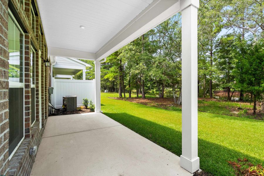 Exterior details and patio area of a home in Long Bay Golf Club, Longs (Image 4).