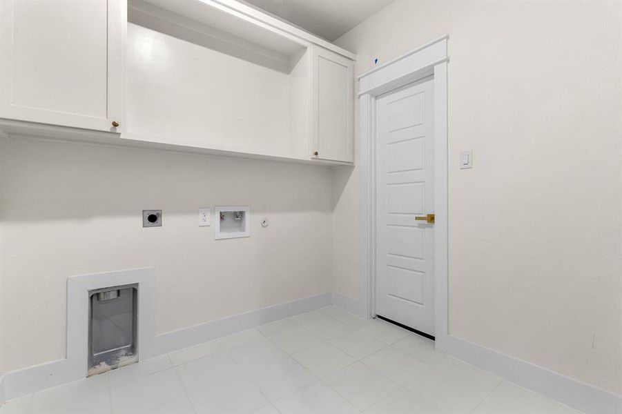 Laundry room with hookup for an electric dryer, hookup for a washing machine, and cabinets