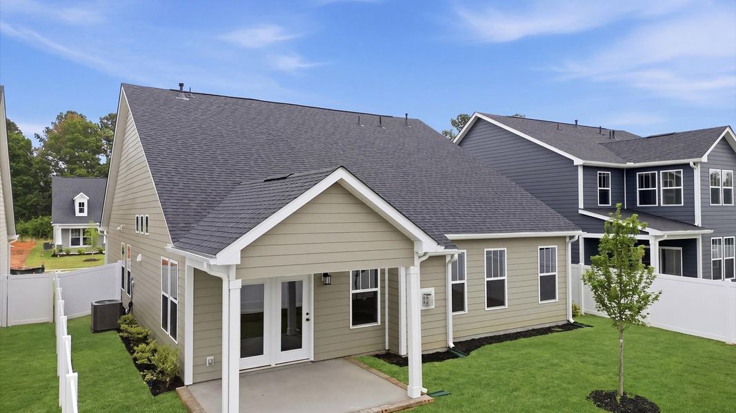 Superior curb appeal continues to the back with a refined, covered outdoor living space by DRB Homes