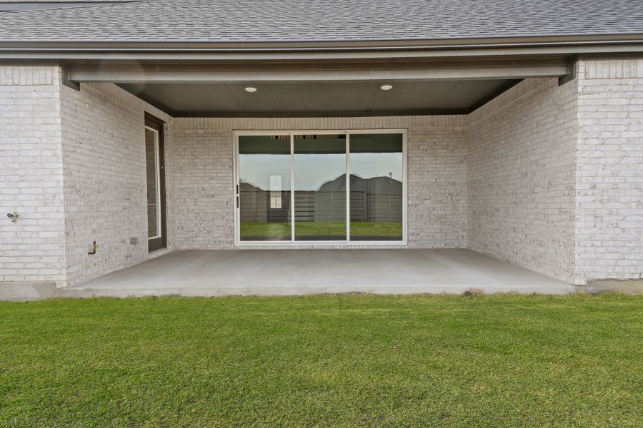 Exterior details and patio area of a home in Union Park, Little Elm (Image 4).