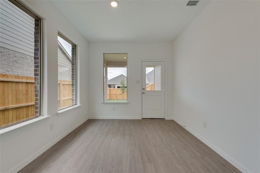 Unfurnished room with light hardwood / wood-style flooring