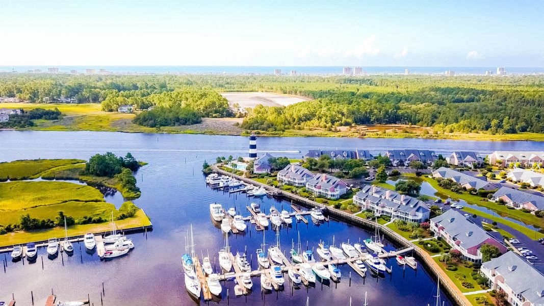 Bird's eye view of a large body of water and a marina Bird's eye view of a large body of water and a marina