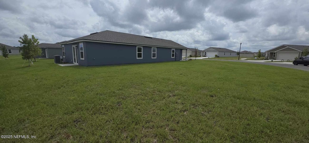 Front exterior of a new home in The Arbors, Jacksonville, FL, highlighting curb appeal (Image 31). Front exterior of a new home in The Arbors, Jacksonville, FL, highlighting curb appeal (Image 31).