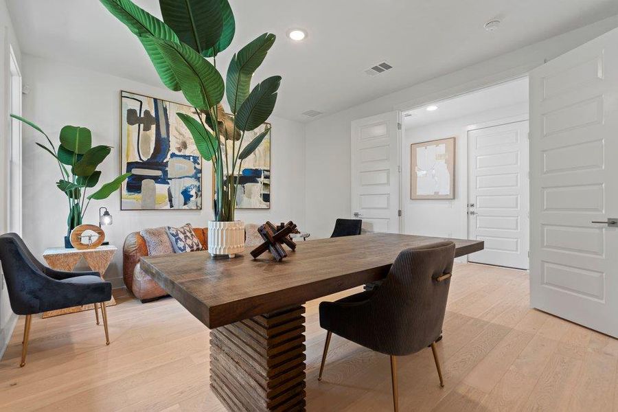 Elegant bedroom retreat with grand double doors, and a bright, airy ambiance.