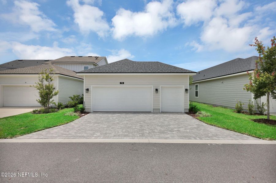 Front exterior of a new home in Seabrook Village at Seabrook, Nocatee, FL, highlighting curb appeal (Image 24).