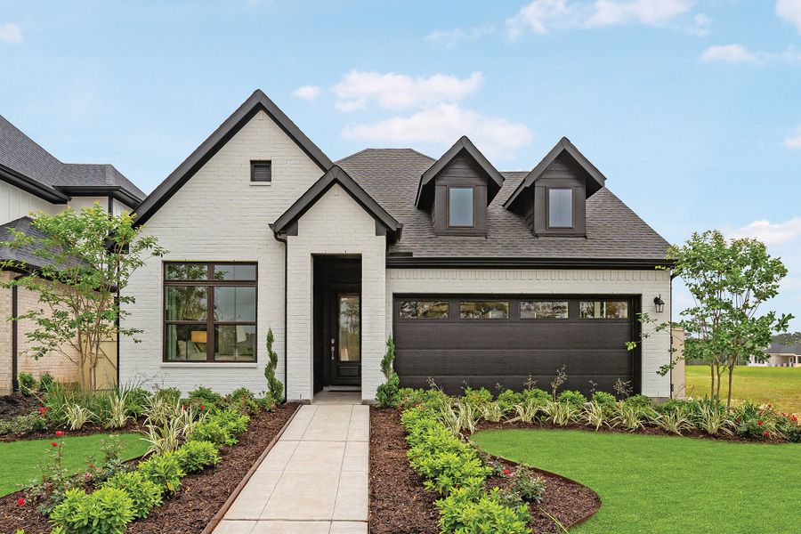 Front exterior of a new home in Audubon 45' Homesites, Magnolia, TX, highlighting curb appeal (Image 21).