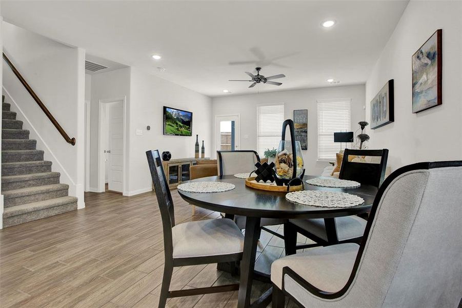 Dining area featuring ceiling fan and light hardwood / wood-style floors