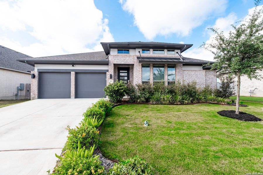 Front exterior of a new home in Meadows of Mill Creek, Seguin, TX, highlighting curb appeal (Image 24).