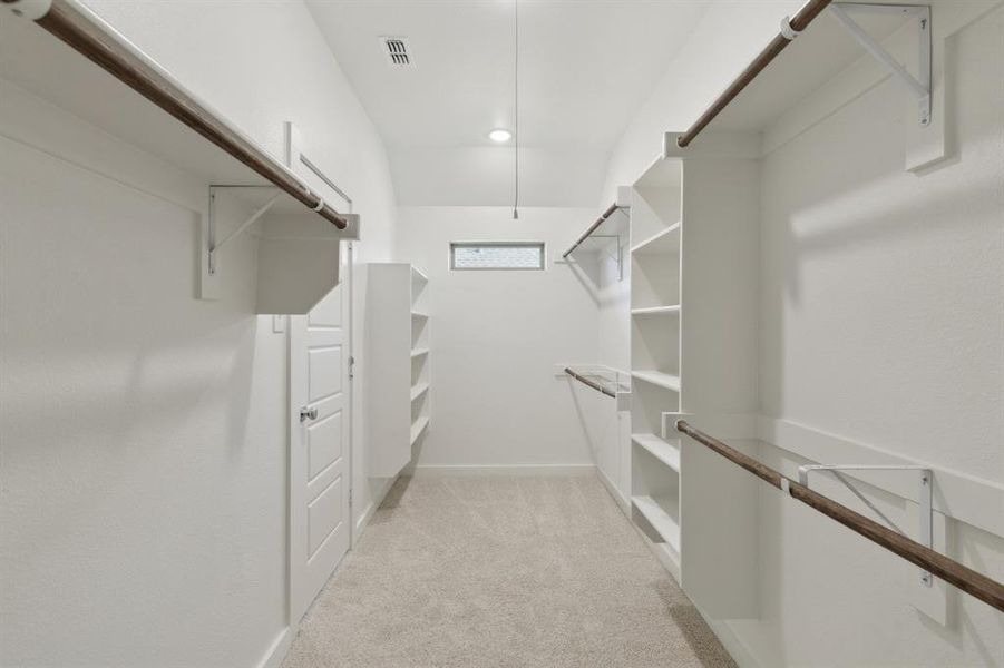 Primary Closet in the Heisman home plan by Trophy Signature Homes – REPRESENTATIVE PHOTO