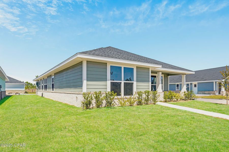 Front exterior of a new home in East Bay, Panama City, FL, highlighting curb appeal (Image 14).