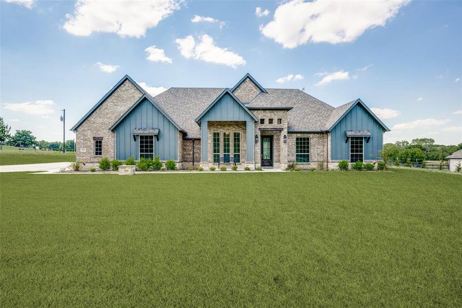 View of front of house with a front lawn