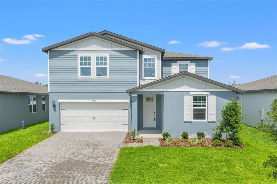 Front exterior of a new home in Two Rivers - Classic Series, Zephyrhills, FL, highlighting curb appeal (Image 26).