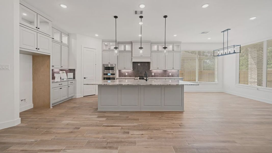Representative furnished interior of a home built from the Waterloo by Chesmar Homes in Attwater 65's, Waller (Image 3).