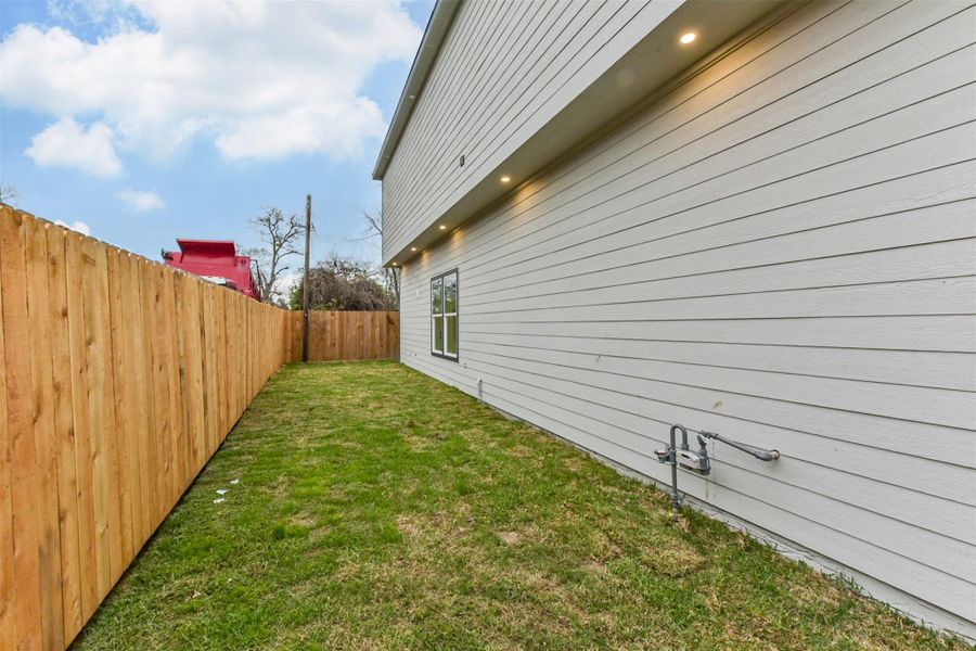 Exterior details and patio area of a home in , Houston (Image 3).