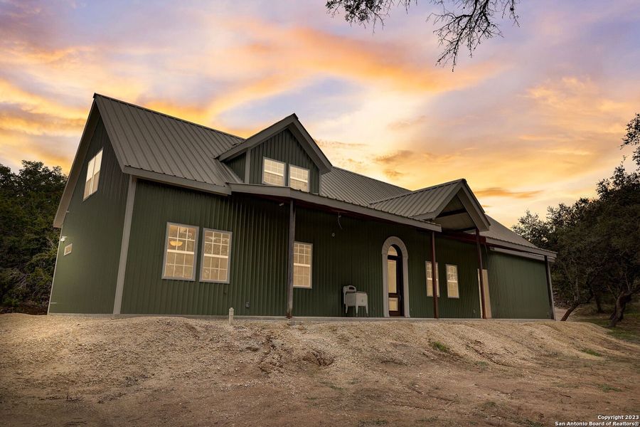 Front exterior of a new home in , Bandera, TX, highlighting curb appeal (Image 23).