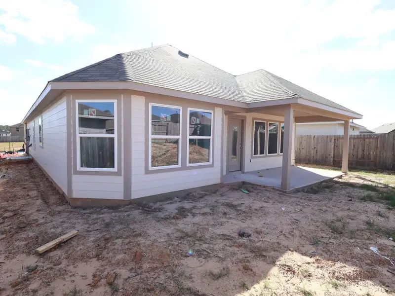 Exterior details and patio area of a home in Magnolia Ridge, Magnolia (Image 3).
