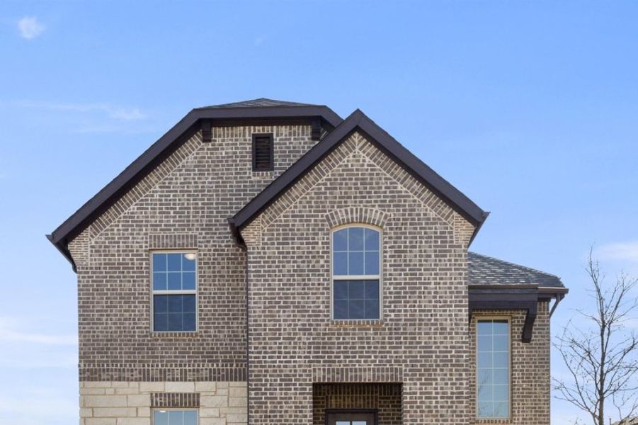 Representative exterior photo of a completed home built from the Magnolia by UnionMain Homes in Edgewater, Fate, TX (Image 2). Representative exterior photo of a completed home built from the Magnolia by UnionMain Homes in Edgewater, Fate, TX (Image 2).