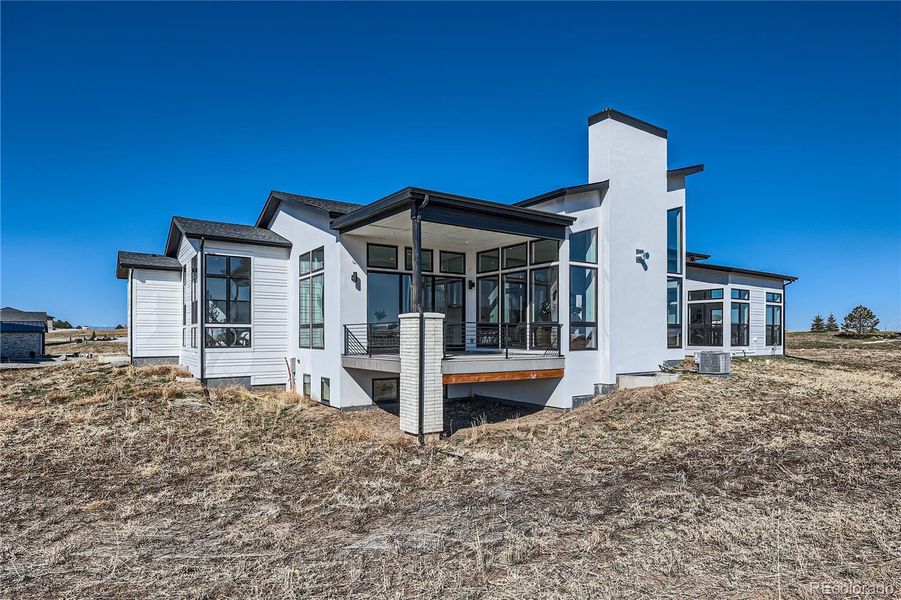 Front exterior of a new home in , Parker, CO, highlighting curb appeal (Image 22).