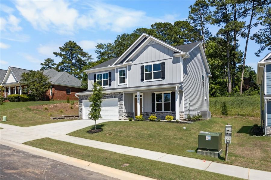 Front exterior of a new home in Forrest Bluff, North Augusta, SC, highlighting curb appeal (Image 19). Front exterior of a new home in Forrest Bluff, North Augusta, SC, highlighting curb appeal (Image 19).