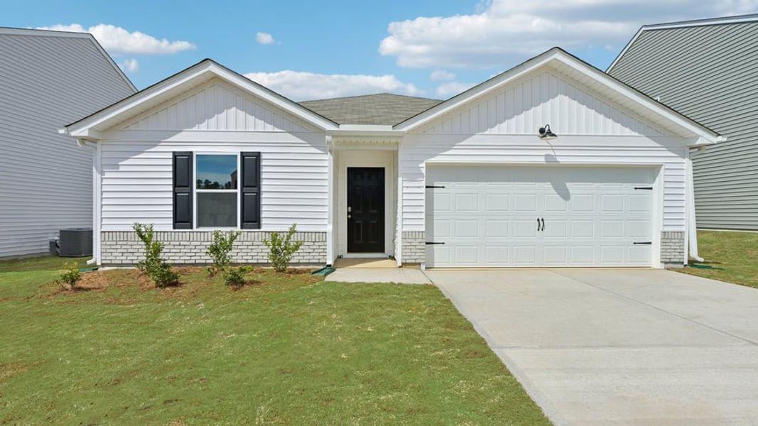 Front exterior of a new home in The Villas at Laurel Oaks, Sanford, NC, highlighting curb appeal (Image 1). Front exterior of a new home in The Villas at Laurel Oaks, Sanford, NC, highlighting curb appeal (Image 1).