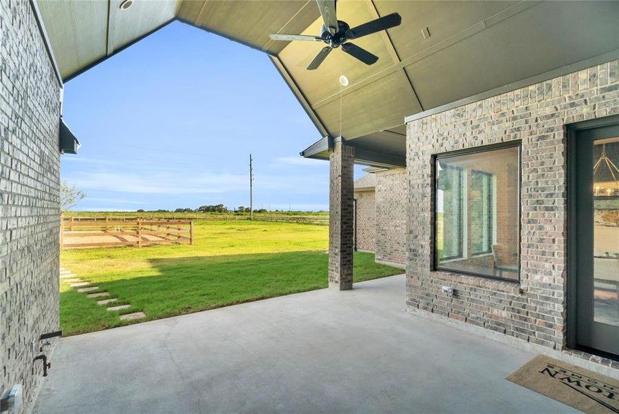 Huge covered patio with a vaulted ceiling