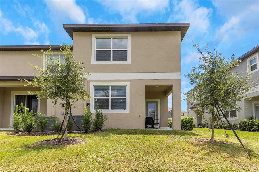 Front exterior of a new home in , Land O' Lakes, FL, highlighting curb appeal (Image 26).